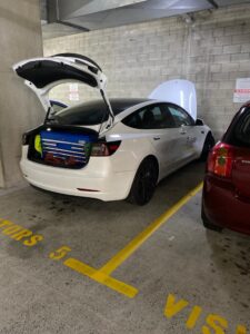 Mechanic in QLD performing pressure checks during vehicle inspection