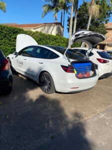 Checking registration plate during a roadworthiness inspection in QLD