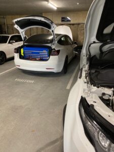 Mechanic in Queensland inspecting car brake system for roadworthiness